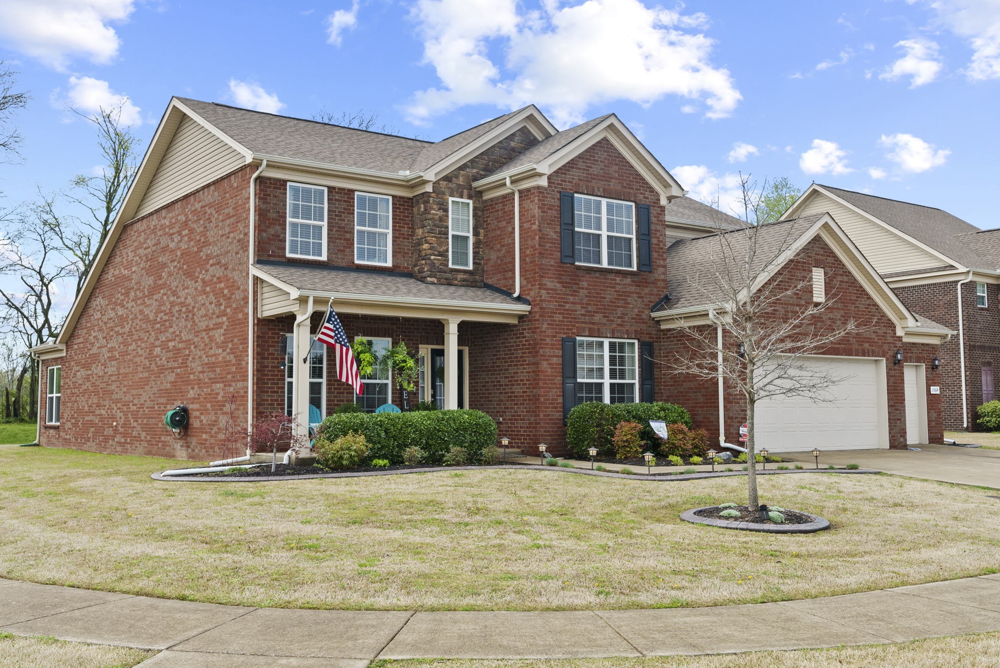 1064 Addington Road Hendersonville, TN 37075 - Photo 4 of 55 a front view of a house with garden