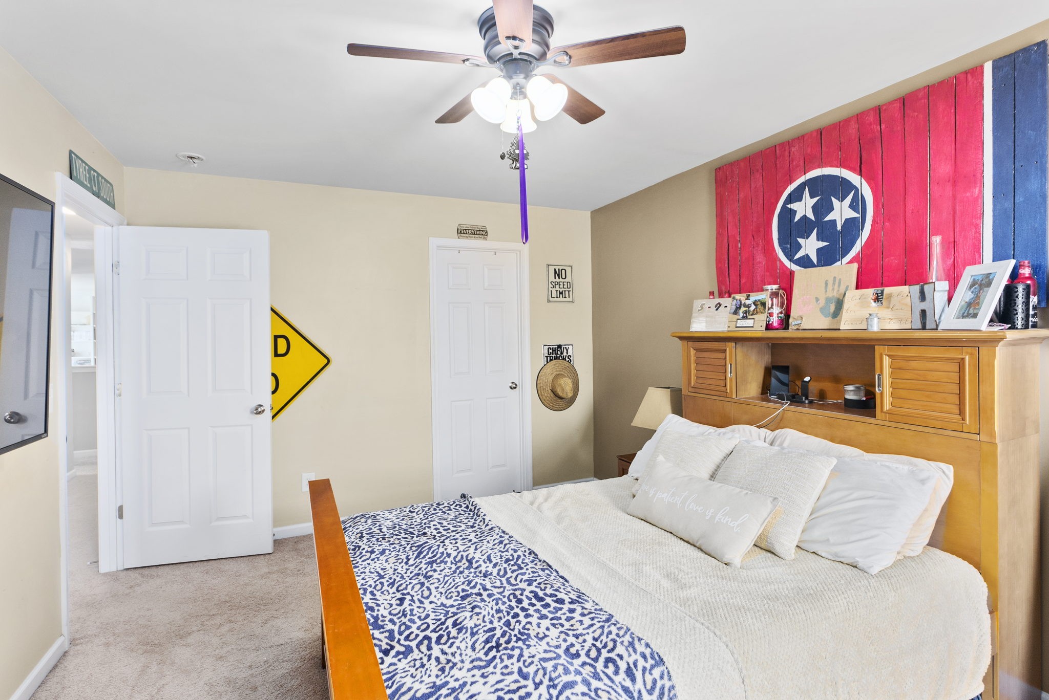 1064 Addington Road Hendersonville, TN 37075 - Photo 46 of 55 a bedroom with a bed and a chandelier