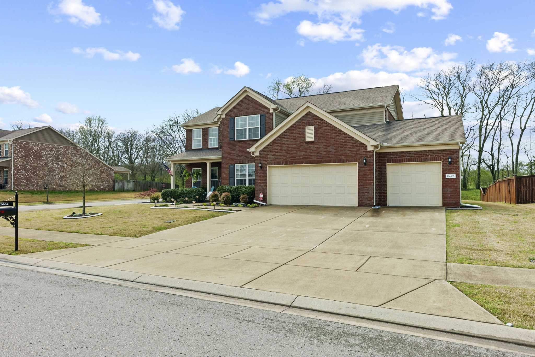 1064 Addington Road Hendersonville, TN 37075 - Photo 5 of 55 a front view of a house with a yard and garage