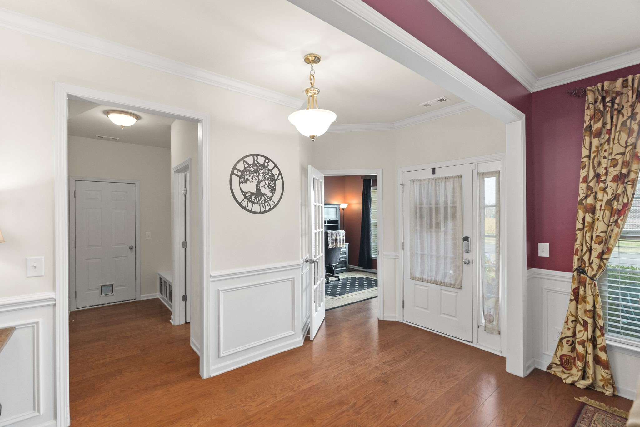1064 Addington Road Hendersonville, TN 37075 - Photo 7 of 55 a view of a hallway with entryway wooden floor and front door