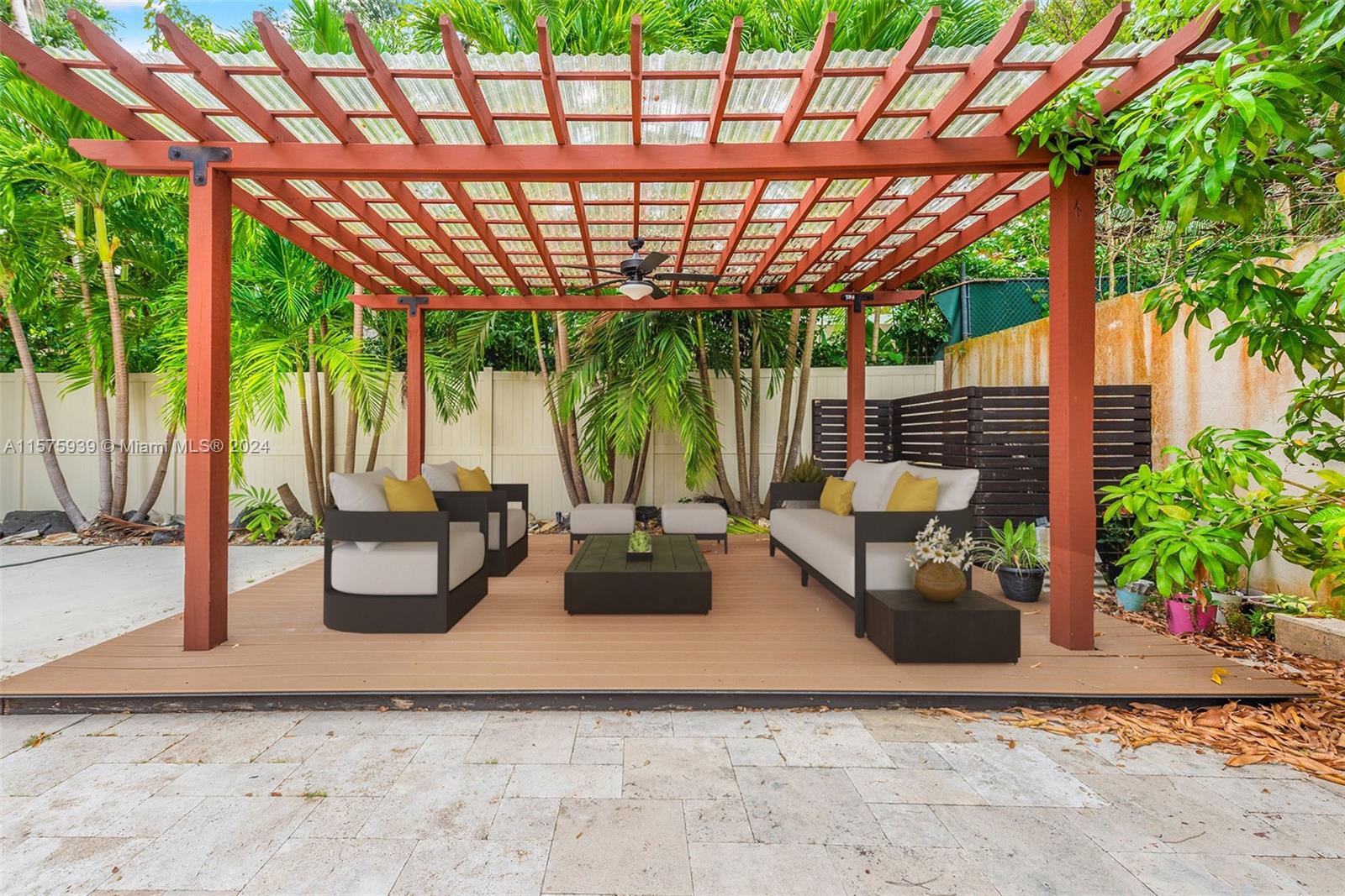 2811 Southwest 22nd Avenue Miami, FL 33133 - Photo 12 of 39 a view of a patio with couches and potted plants