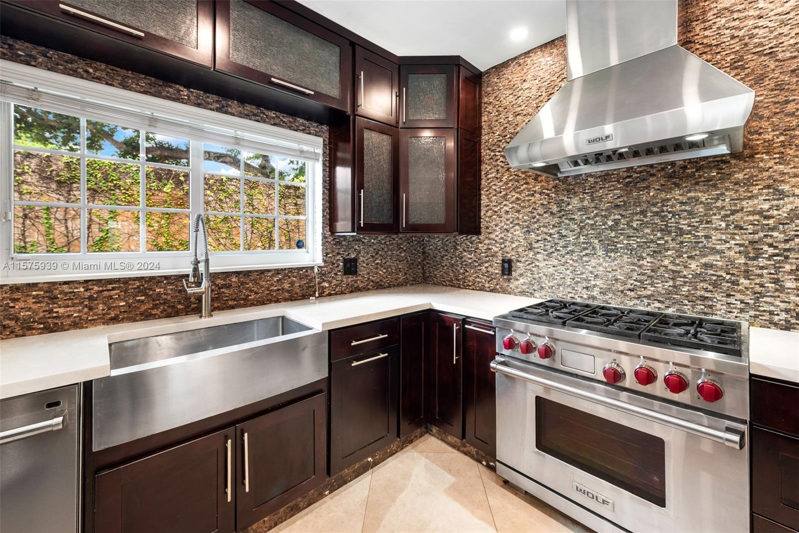 2811 Southwest 22nd Avenue Miami, FL 33133 - Photo 18 of 39 a kitchen with a sink and a stove