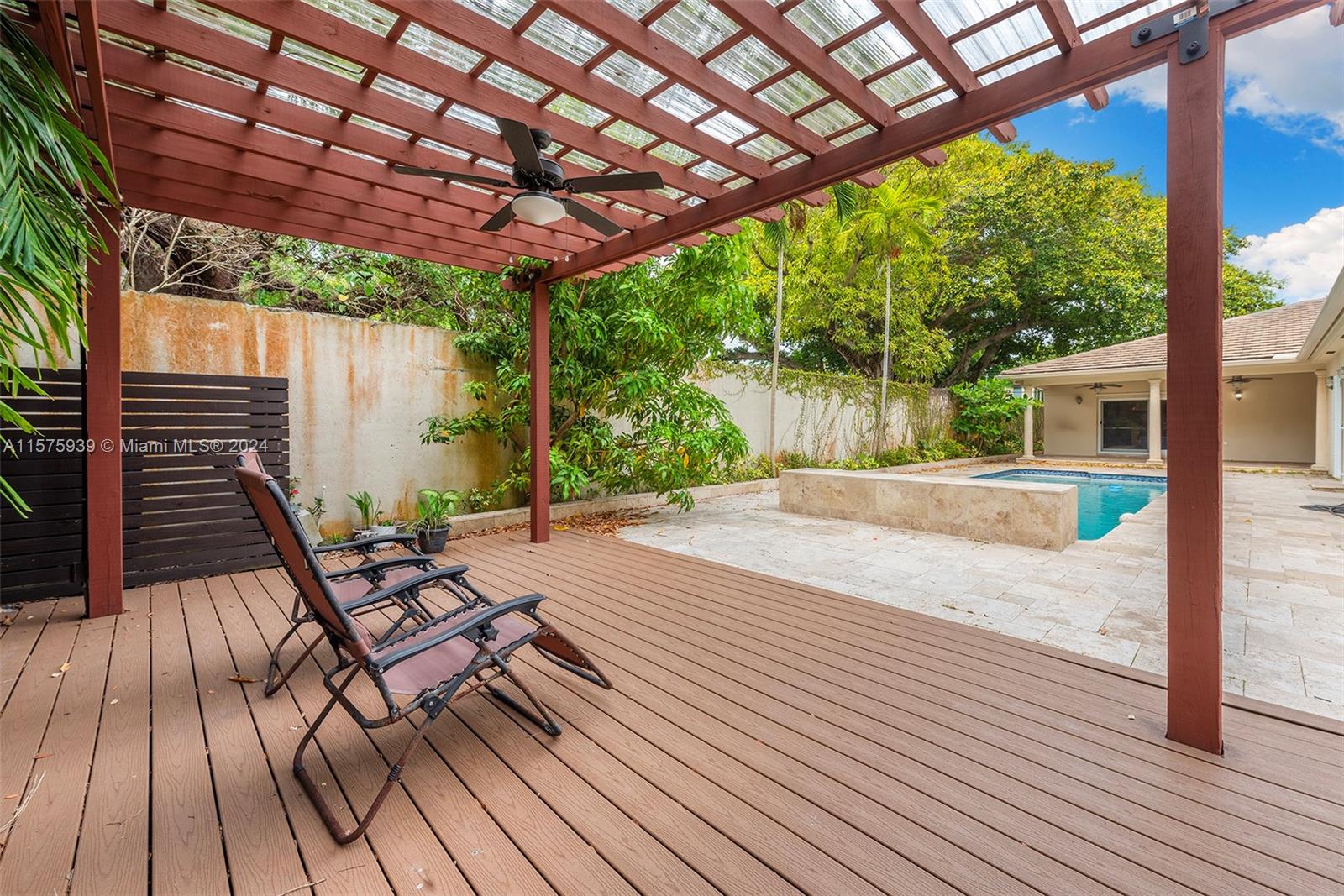 2811 Southwest 22nd Avenue Miami, FL 33133 - Photo 21 of 39 a patio with lawn chairs and wooden floor