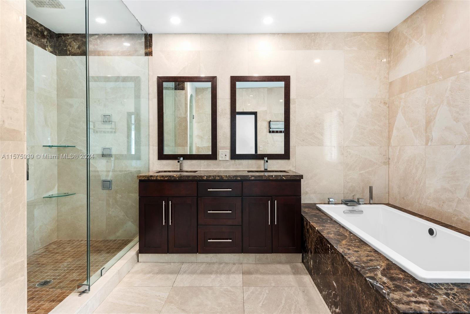 2811 Southwest 22nd Avenue Miami, FL 33133 - Photo 23 of 39 a bathroom with a granite countertop double vanity sink mirror and shower