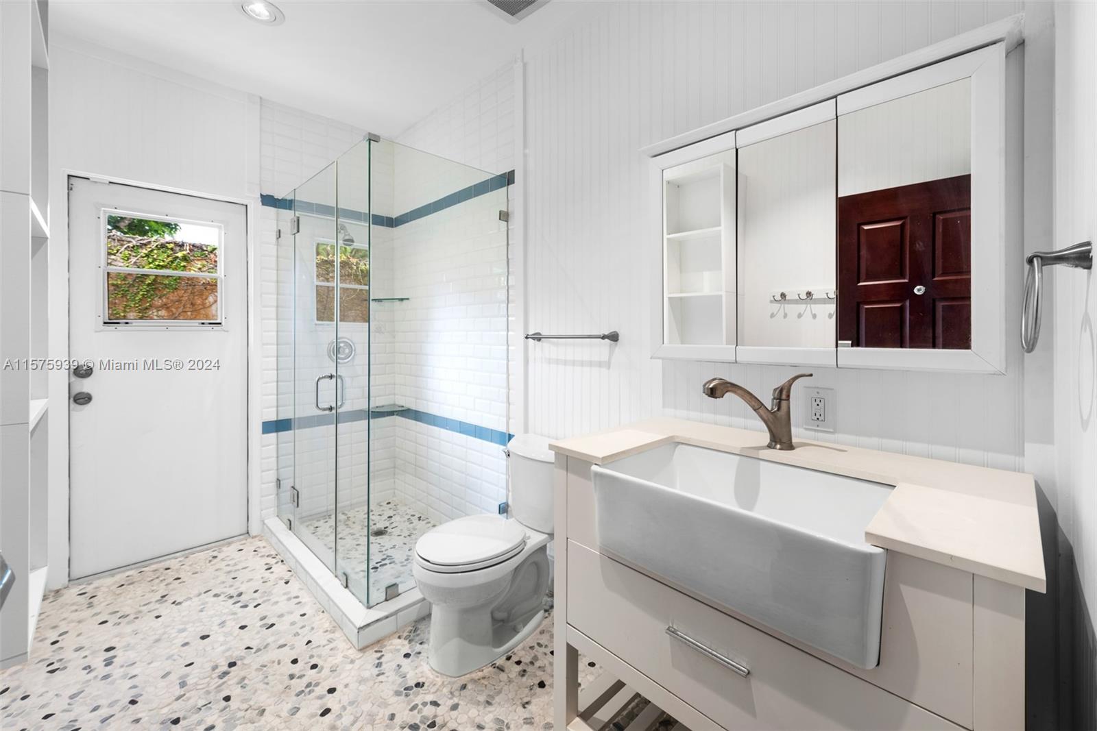 2811 Southwest 22nd Avenue Miami, FL 33133 - Photo 32 of 39 a bathroom with a sink toilet and shower