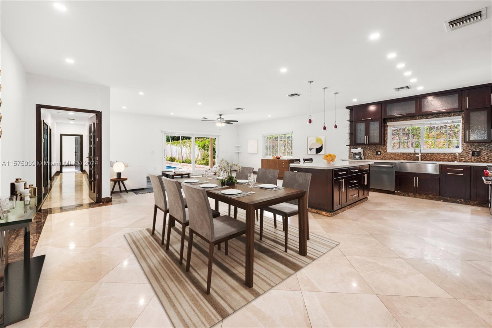 2811 Southwest 22nd Avenue Miami, FL 33133 - Photo 5 of 39 a view of a dining room with furniture