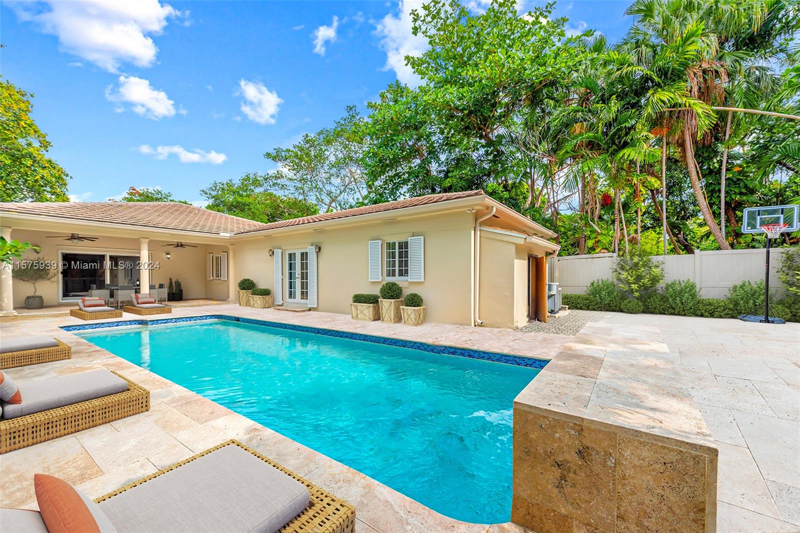 2811 Southwest 22nd Avenue Miami, FL 33133 - Photo 9 of 39 a view of a house with swimming pool and a yard
