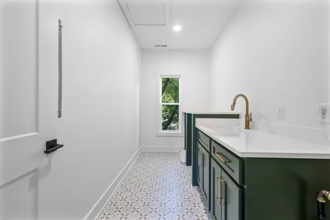 a bathroom with a sink and mirror