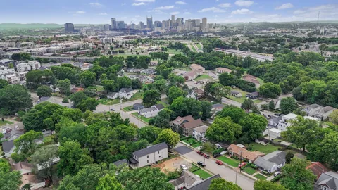 an aerial view of a city with lots of residential buildings