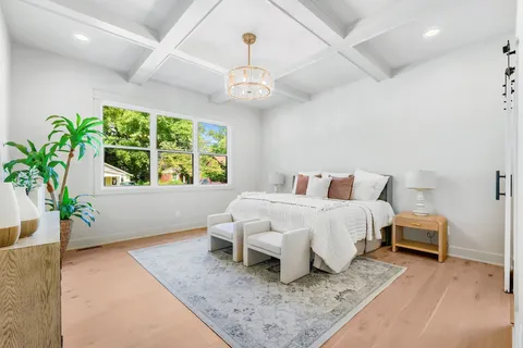 a bedroom with bed and a window