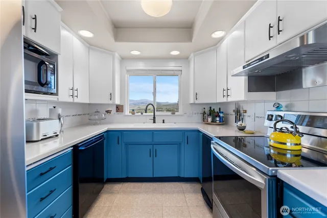 a view of a dining room and a table with chairs