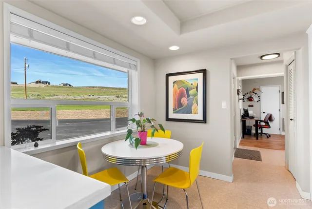 a view of a kitchen with fridge and sink