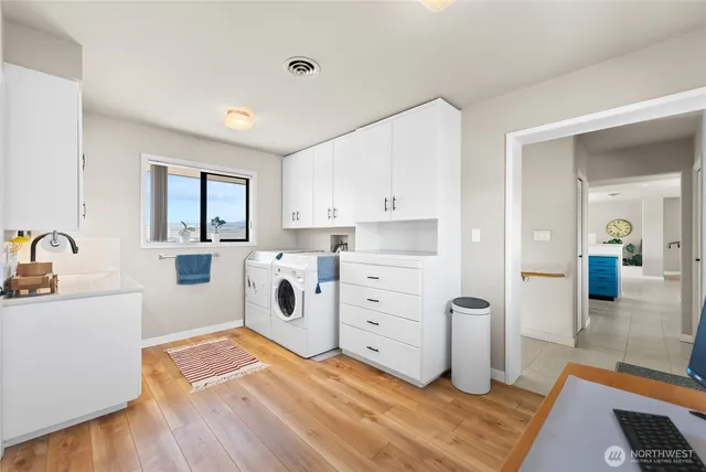 a kitchen with a stove a sink and a refrigerator