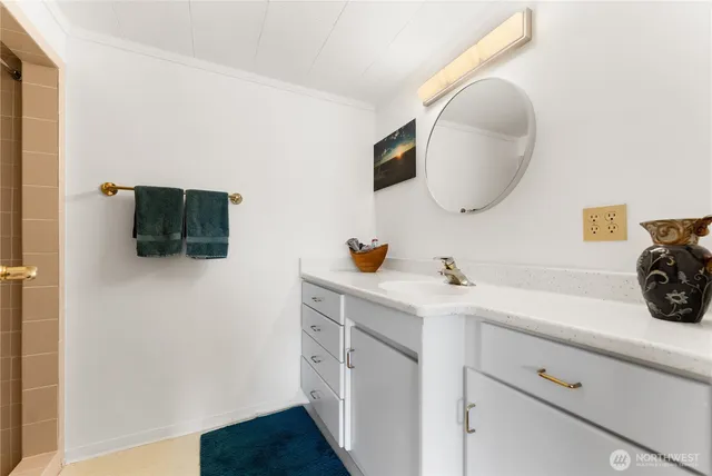 an empty room with a wooden floor and windows