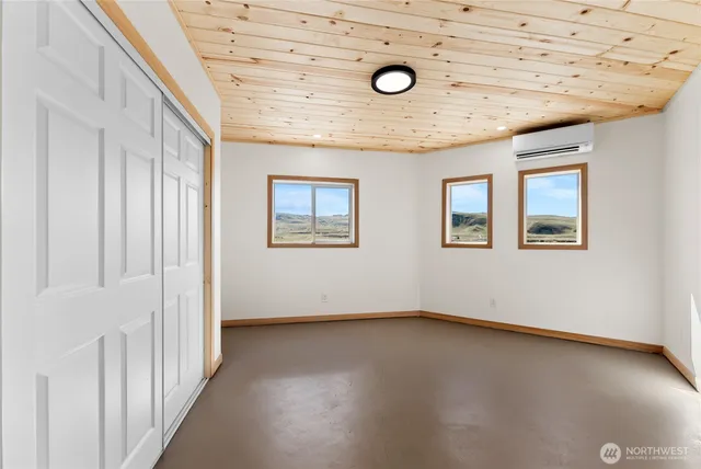 an empty room with fan