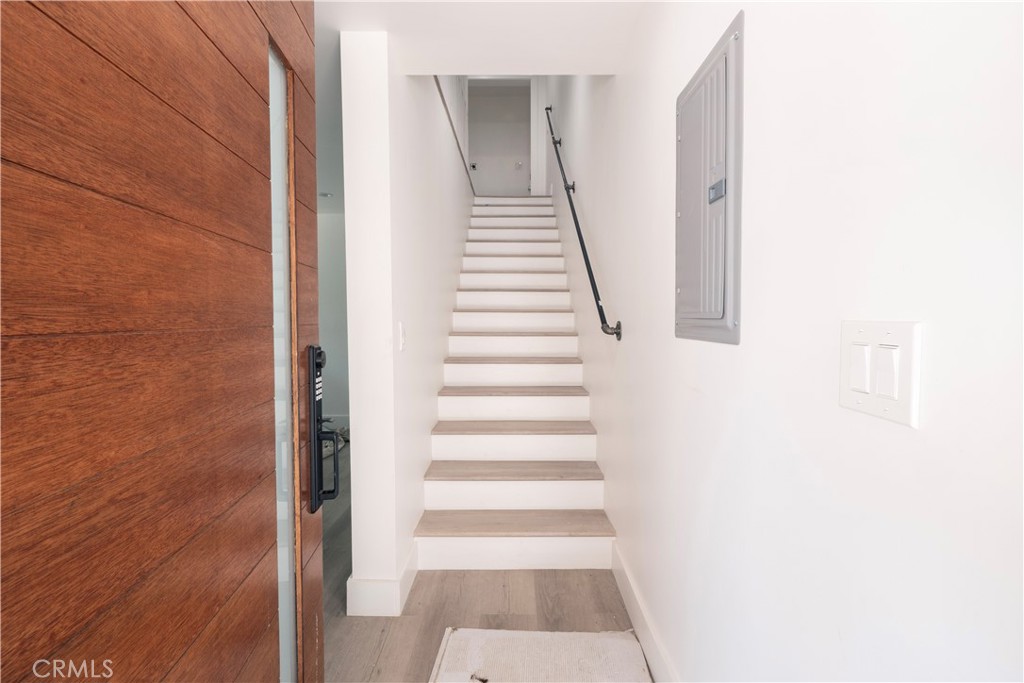 a view of a hallway with staircase