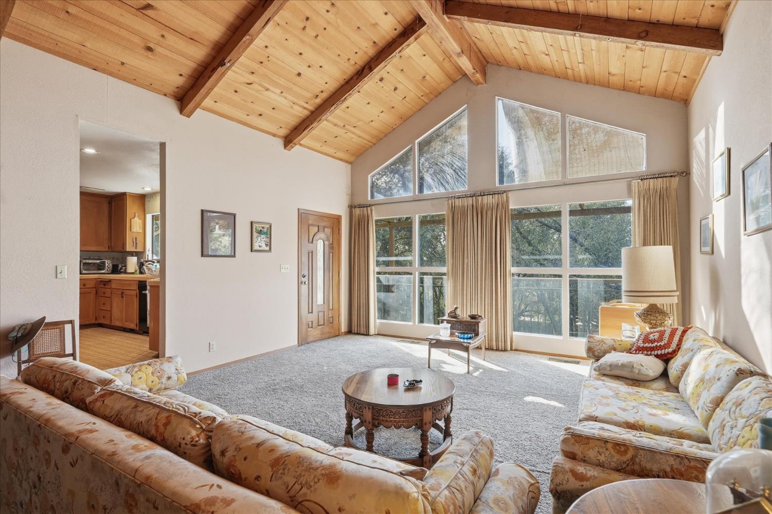 51590 Coyote Ridge Road Oakhurst, CA 93644 - Photo 13 of 49 a living room with furniture and a large window