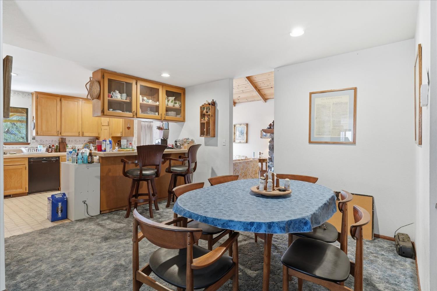 51590 Coyote Ridge Road Oakhurst, CA 93644 - Photo 14 of 49 a view of a dining room with furniture