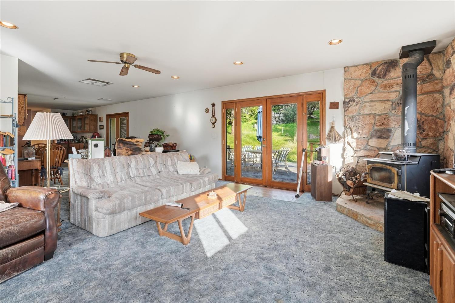 51590 Coyote Ridge Road Oakhurst, CA 93644 - Photo 22 of 49 a living room with furniture and a flat screen tv