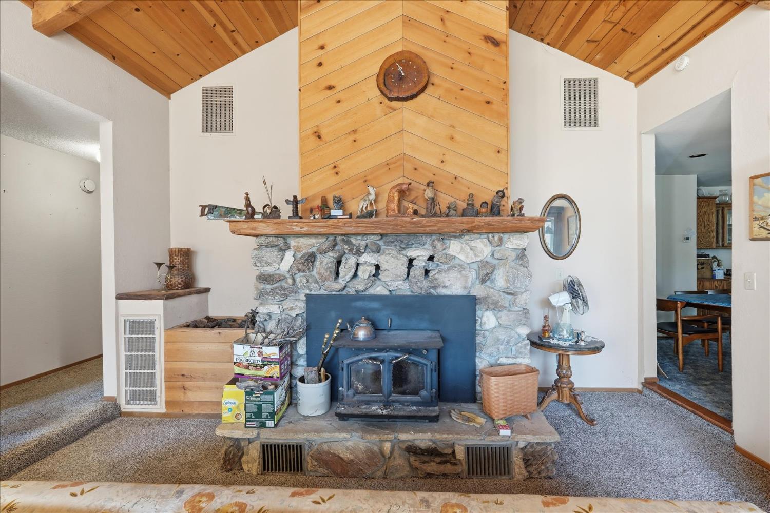 51590 Coyote Ridge Road Oakhurst, CA 93644 - Photo 25 of 49 a living room with furniture and a fireplace