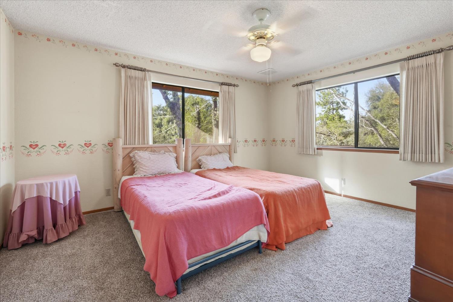 51590 Coyote Ridge Road Oakhurst, CA 93644 - Photo 26 of 49 a bedroom with a bed and a table