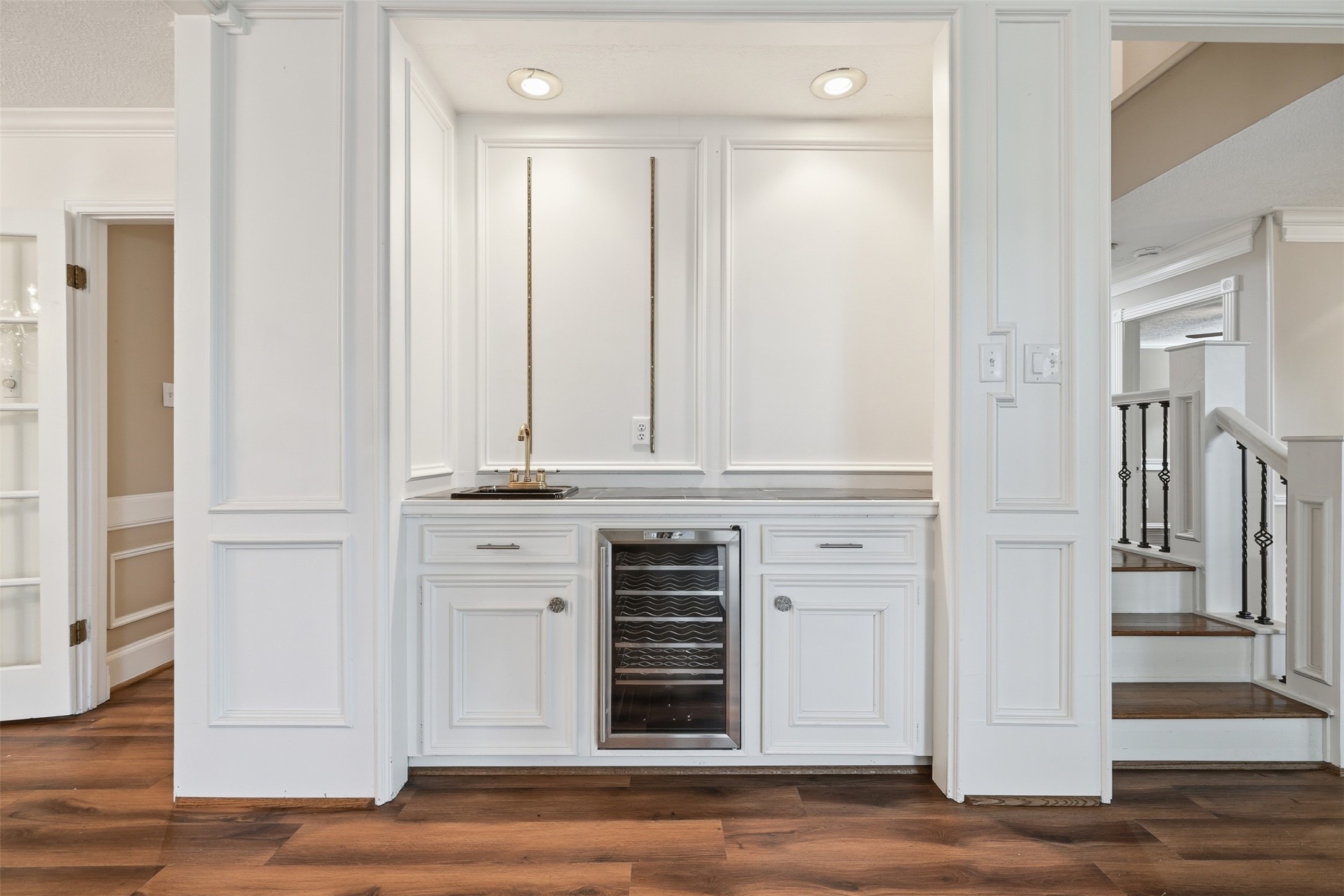 8310 Mentmore Drive Spring, TX 77379 - Photo 11 of 47 Entertain with ease at the built-in wet bar featuring a wine refrigerator, sink, and additional storage—perfect for hosting guests.