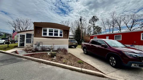 a view of a car parked in front of a house