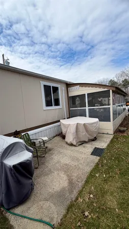 a backyard of a house with basket ball court and outdoor view