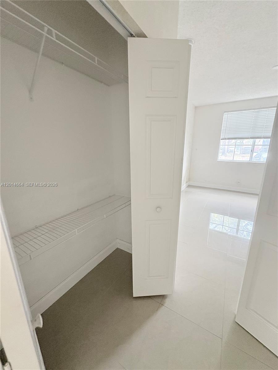 8030 North Nob Hill Road, Unit 105 Tamarac, FL 33321 - Photo 13 of 22 a view of closet