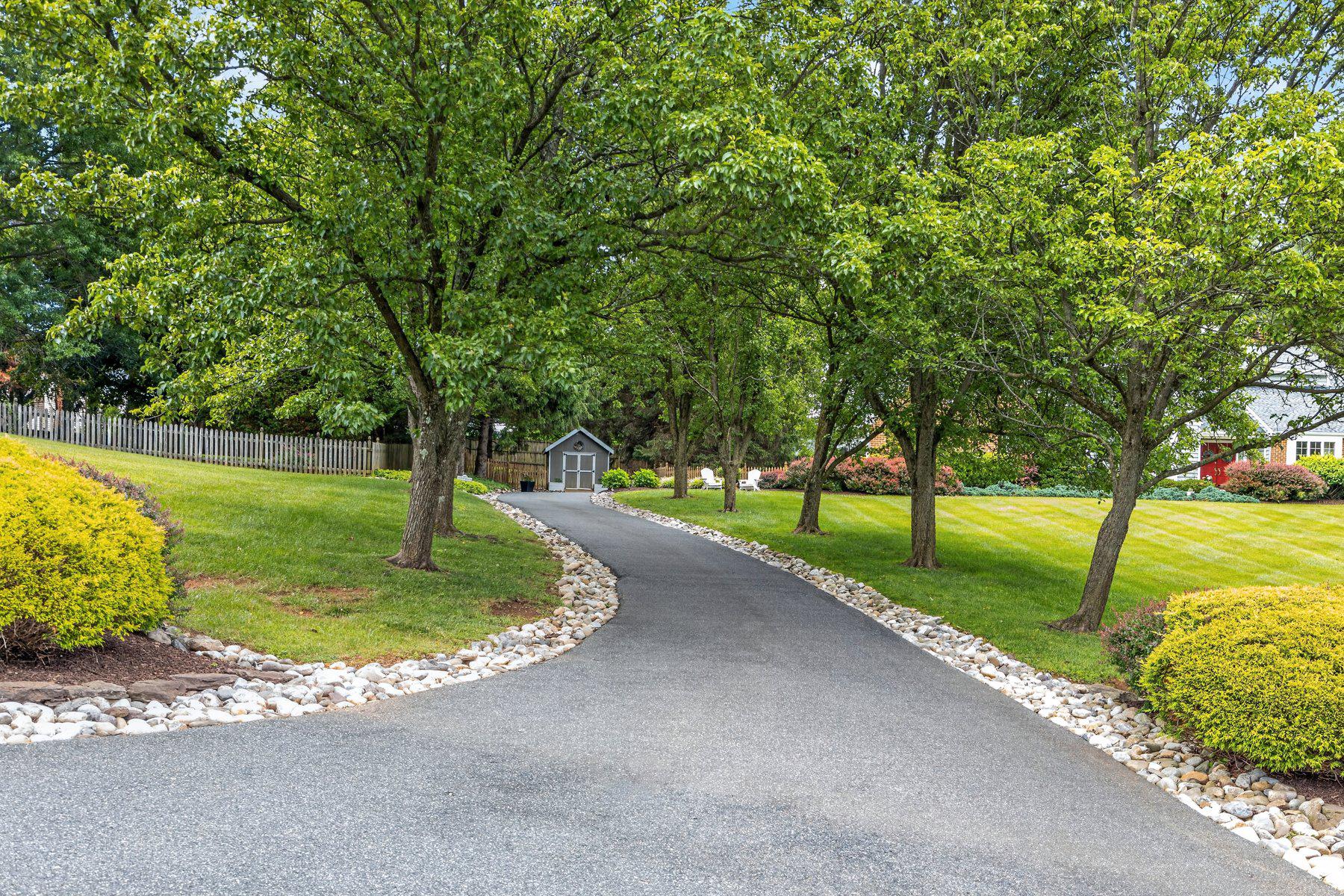 3625 Stansbury Mill Road Phoenix, MD 21131 - Photo 50 of 64 Tree covered driveway with Riverstone border