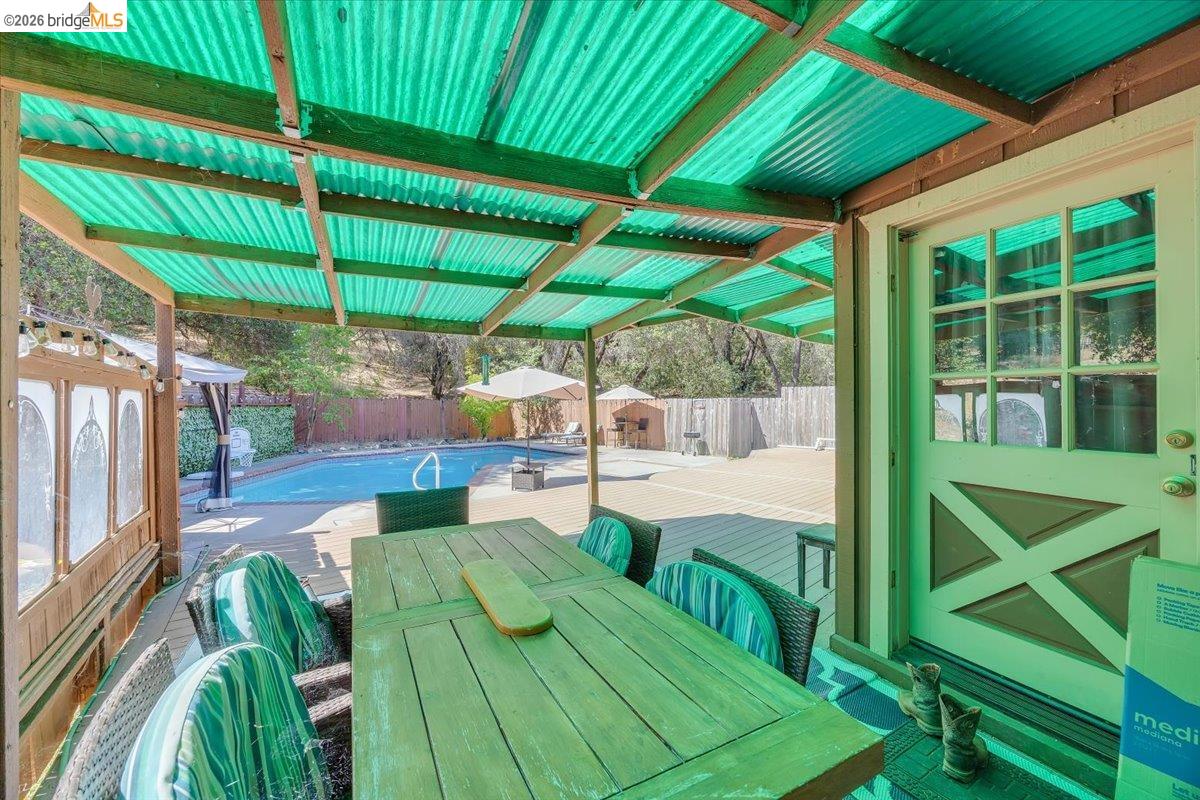 8733 Fraguero Road Sonora, CA 95370 - Photo 62 of 73 Covered patio area featuring a corrugated translucent green roof