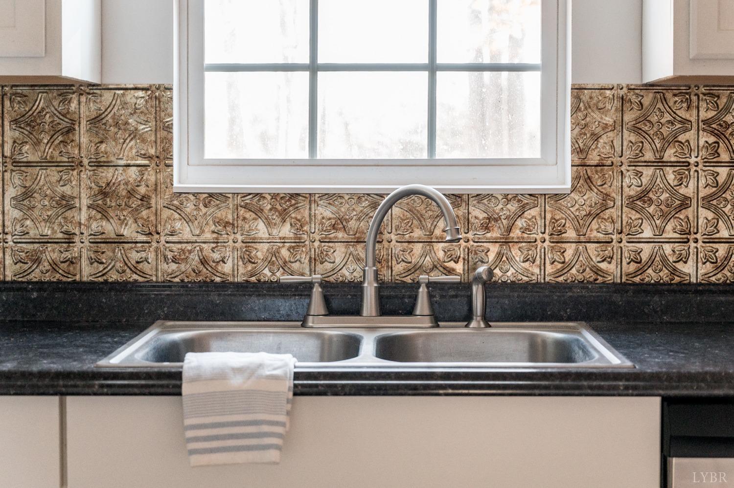 538 Spring Grove Road Spout Spring, VA 24593 - Photo 11 of 44 a close view of sink and tap