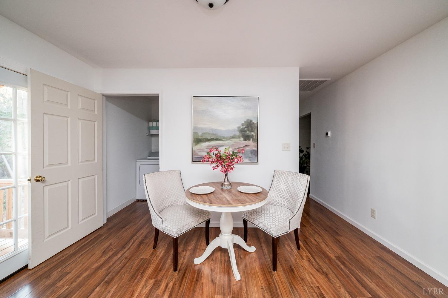 538 Spring Grove Road Spout Spring, VA 24593 - Photo 16 of 44 a view of a dining room with furniture and wooden floor