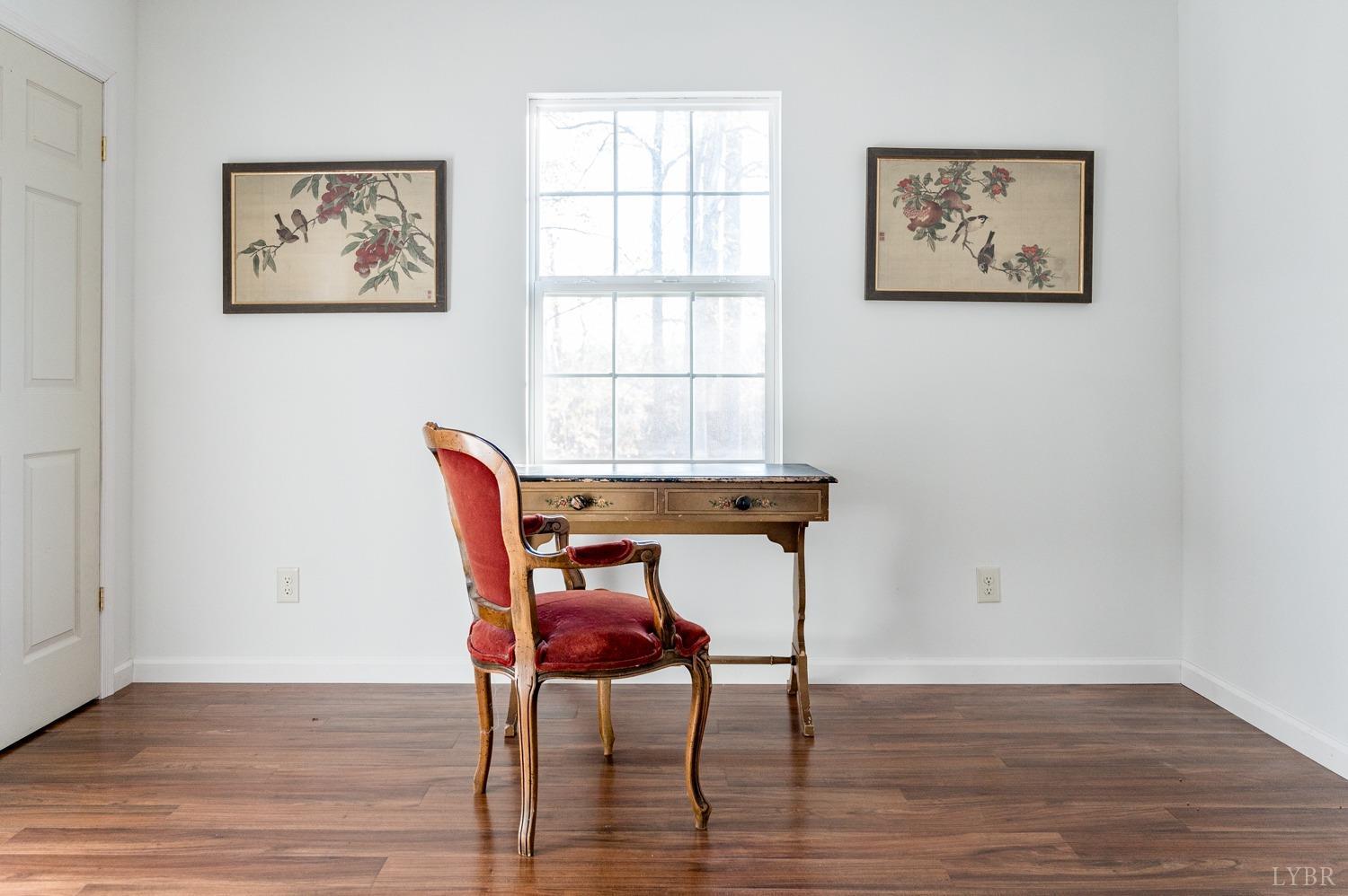 538 Spring Grove Road Spout Spring, VA 24593 - Photo 18 of 44 a workspace with furniture and wooden floor