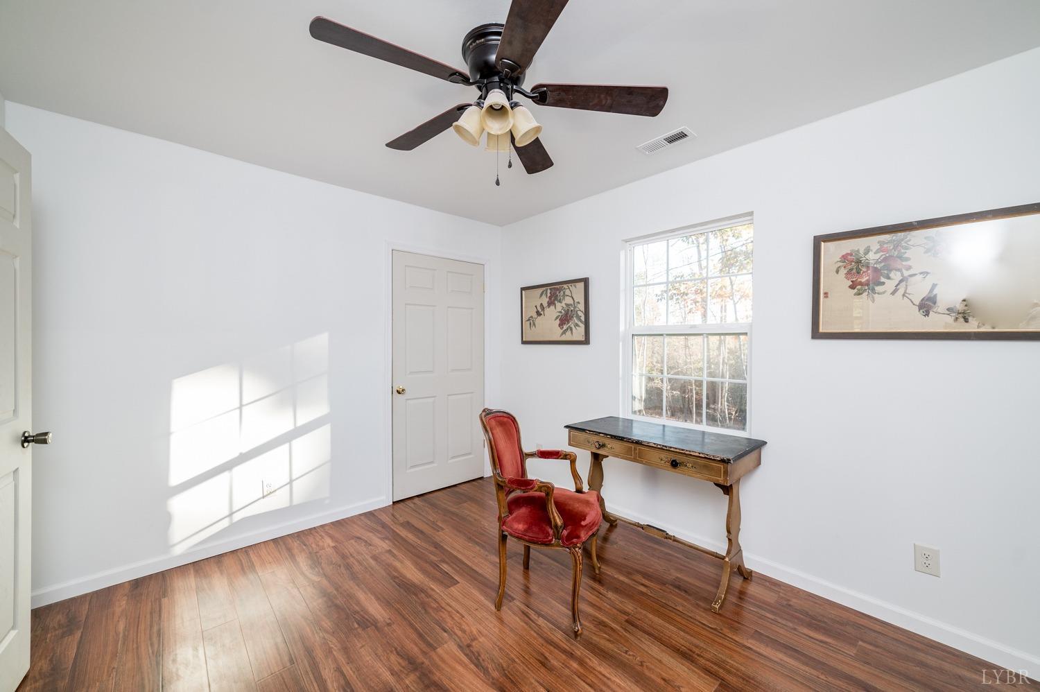 538 Spring Grove Road Spout Spring, VA 24593 - Photo 19 of 44 a workspace with wooden floor and a window