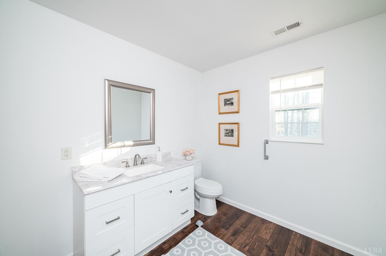 538 Spring Grove Road Spout Spring, VA 24593 - Photo 24 of 44 a bathroom with a sink and a mirror