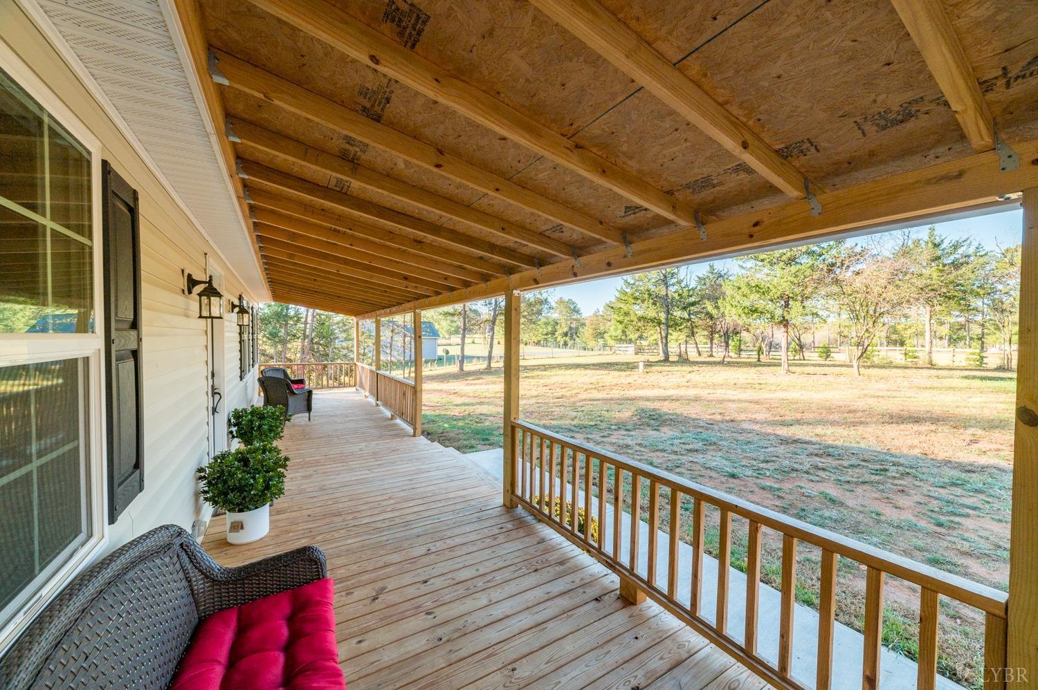 538 Spring Grove Road Spout Spring, VA 24593 - Photo 27 of 44 a porch with wooden floor in outdoor space