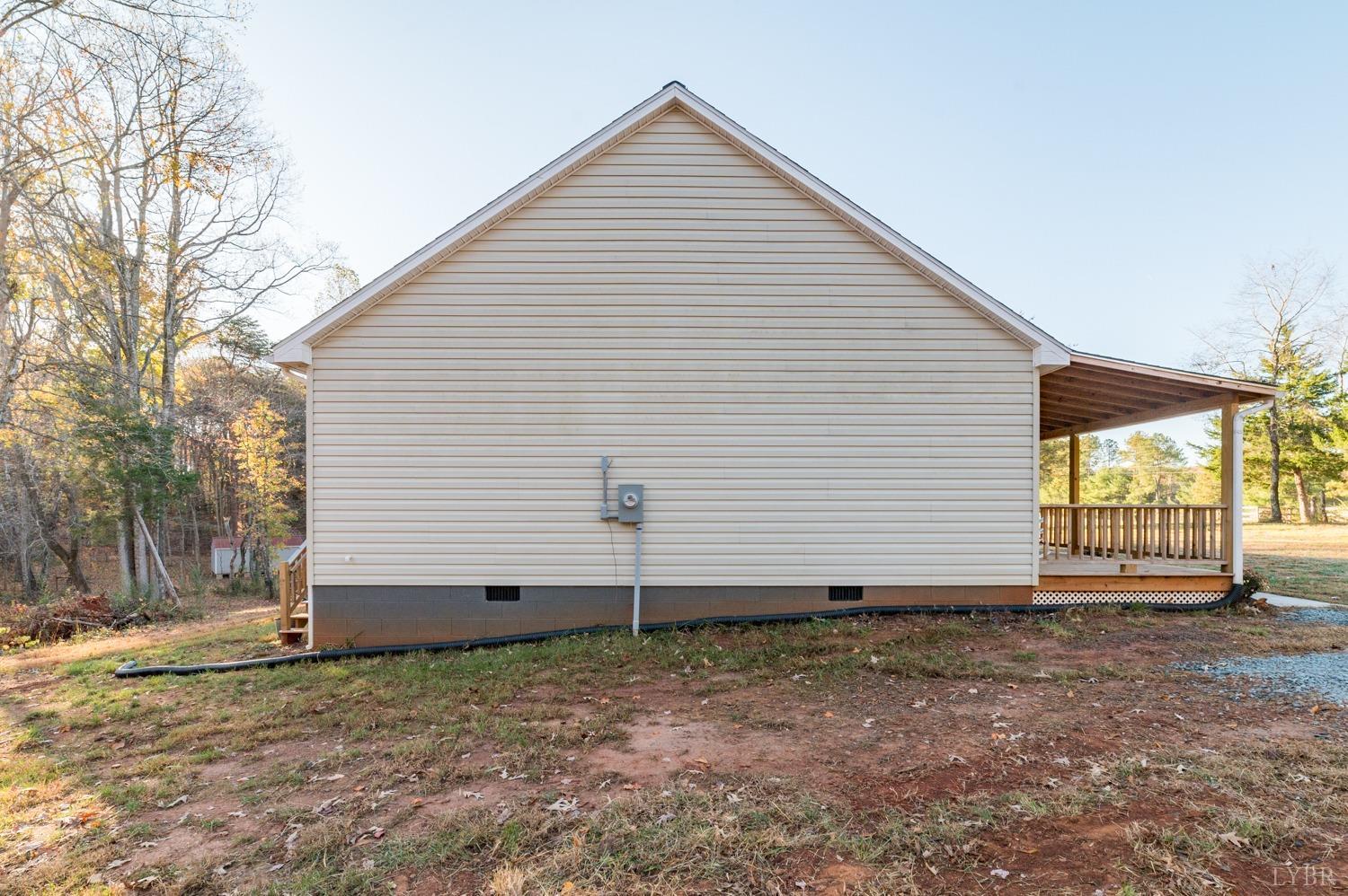 538 Spring Grove Road Spout Spring, VA 24593 - Photo 29 of 44 a view of a house with a yard and wooden fence