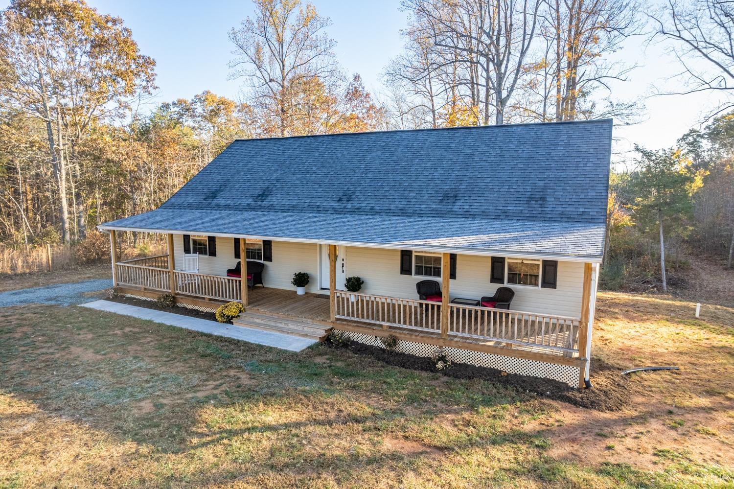 538 Spring Grove Road Spout Spring, VA 24593 - Photo 35 of 44 a view of backyard of house with wooden deck and barbeque oven