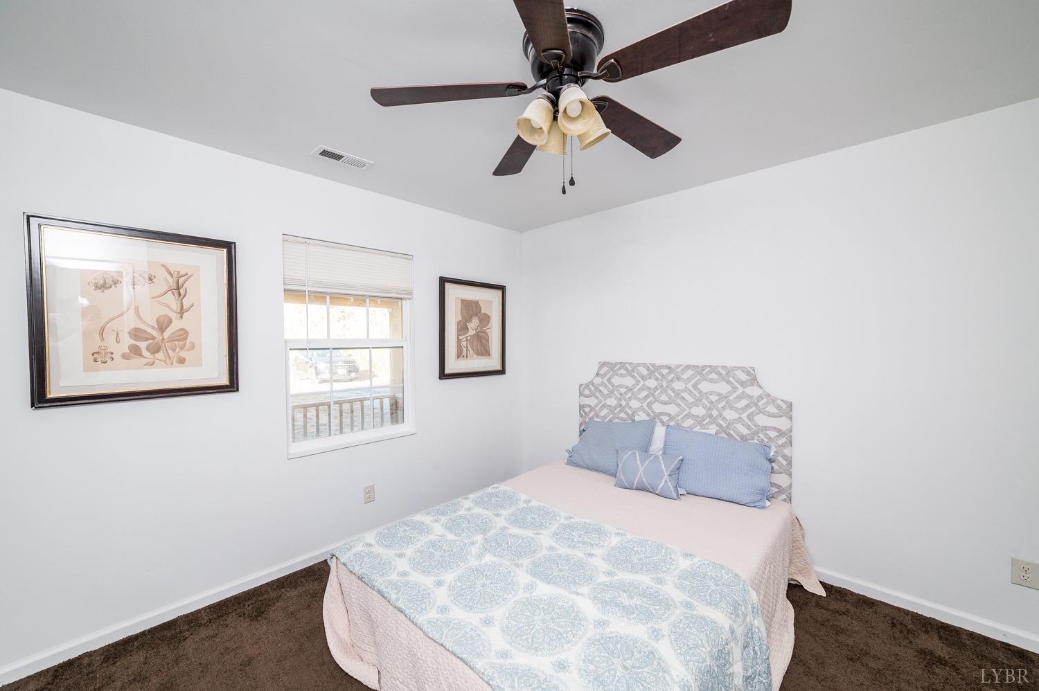 538 Spring Grove Road Spout Spring, VA 24593 - Photo 5 of 44 a bedroom with a large bed and a window
