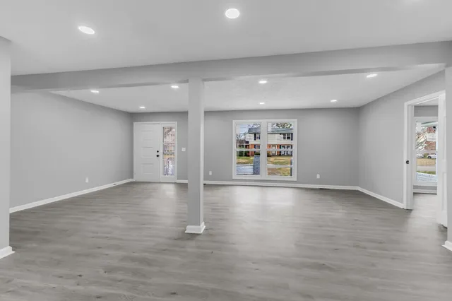 a kitchen with a refrigerator a stove top oven a sink and cabinets