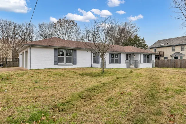 a house with trees in the background