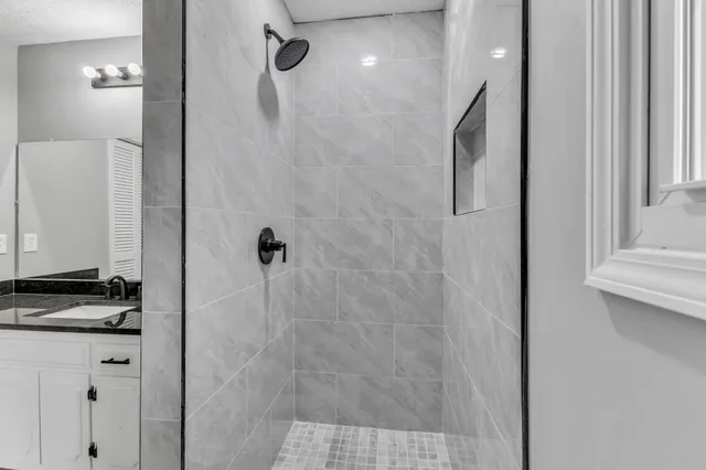 a view of a yard with wooden fence