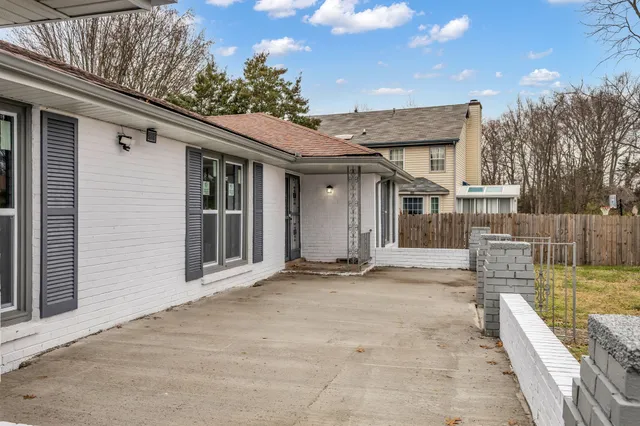 a view of kitchen with refrigerator stove and wooden floor