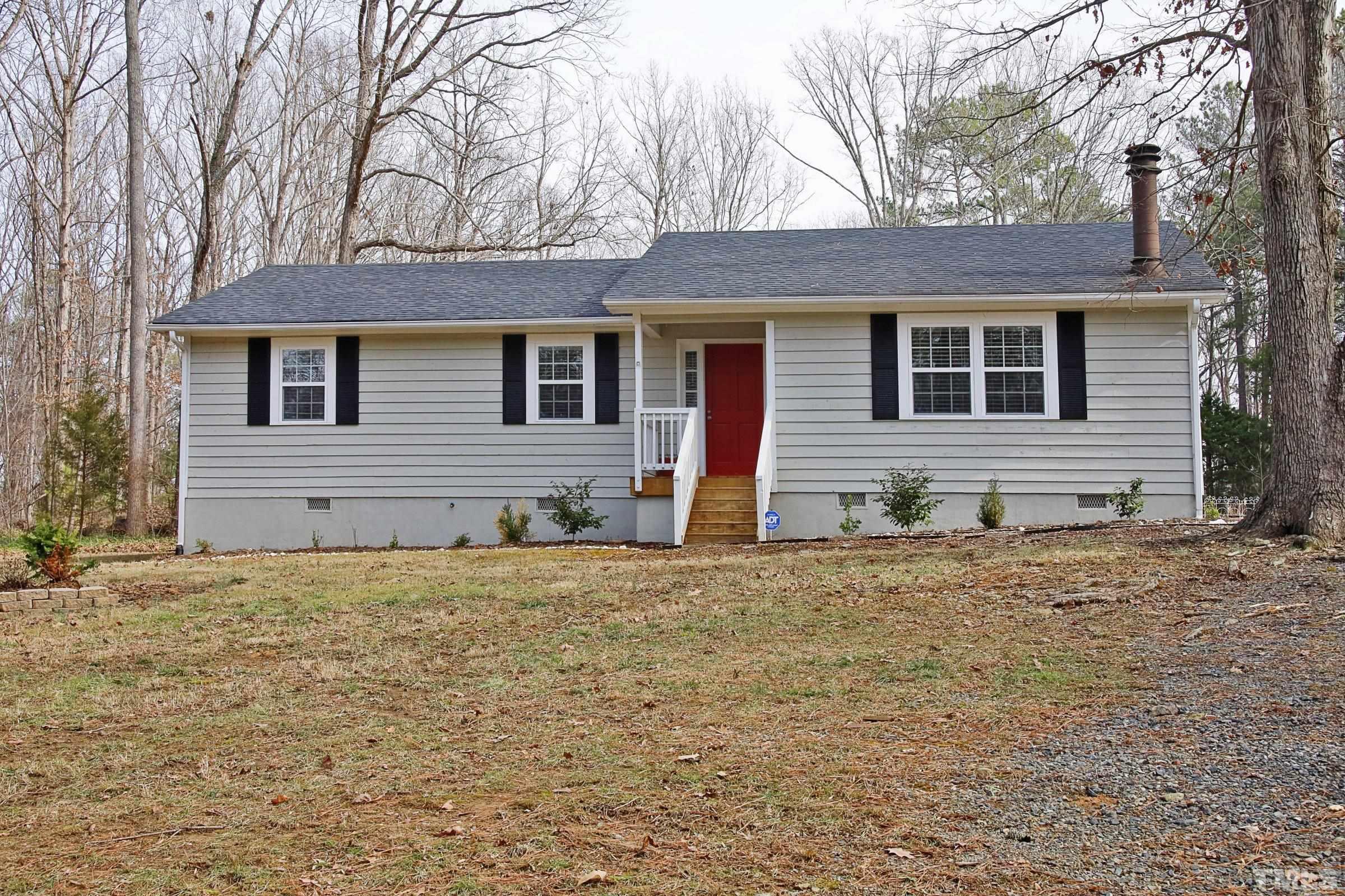 6120 Guess Road Durham, NC 27712 - Photo 1 of 22 a front view of a house with a yard