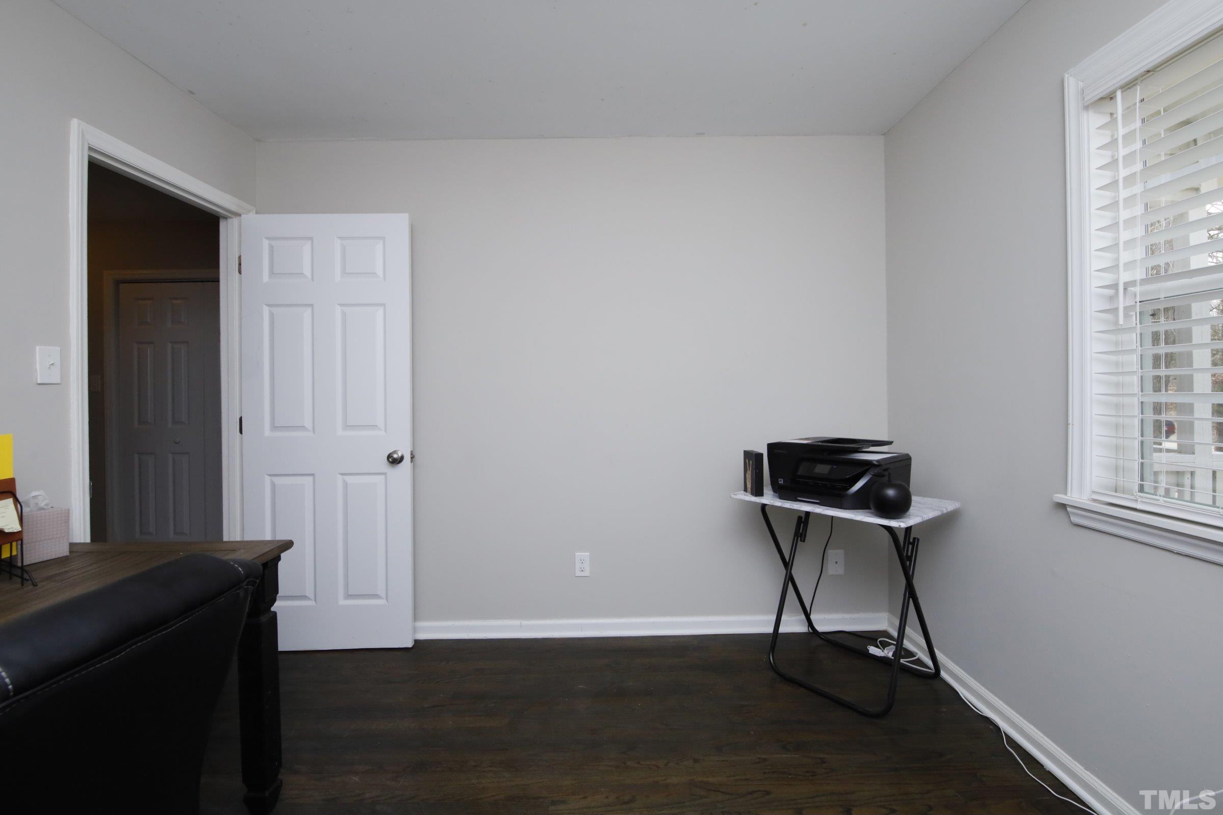 6120 Guess Road Durham, NC 27712 - Photo 15 of 22 a view of a workspace with wooden floor and a window