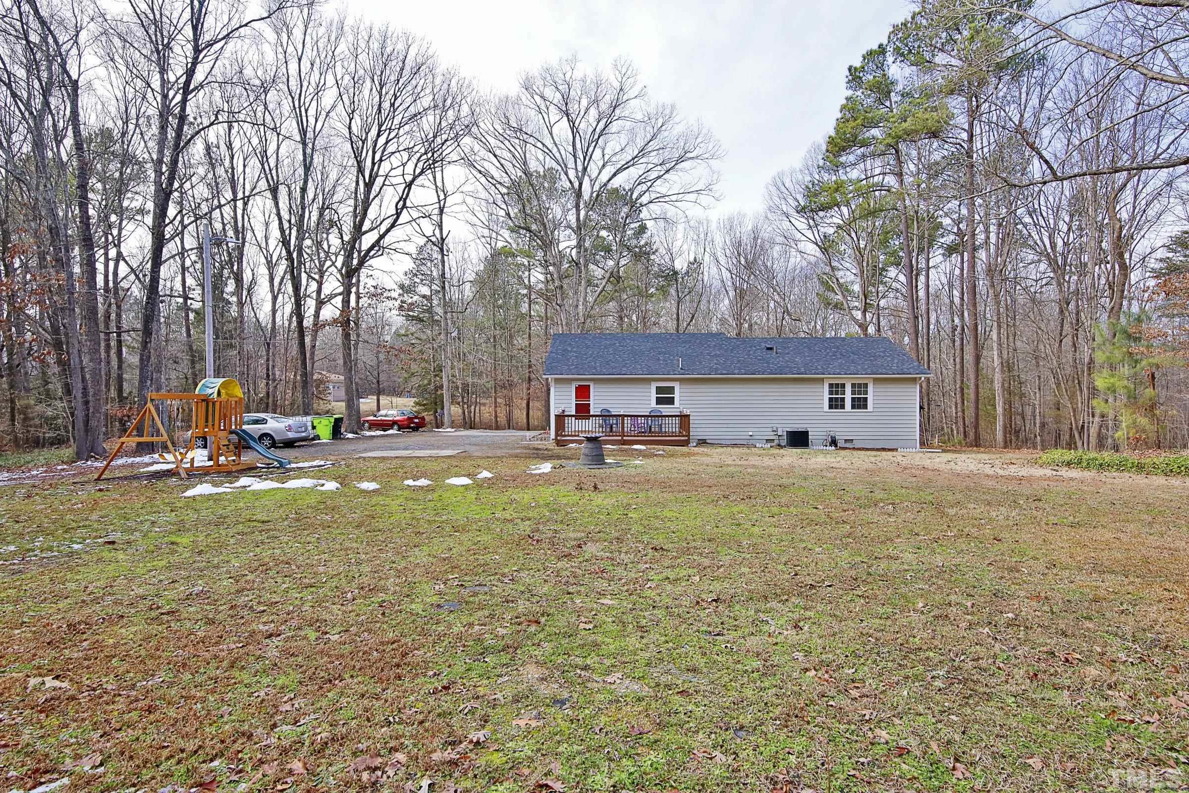 6120 Guess Road Durham, NC 27712 - Photo 20 of 22 a view of a house with a yard