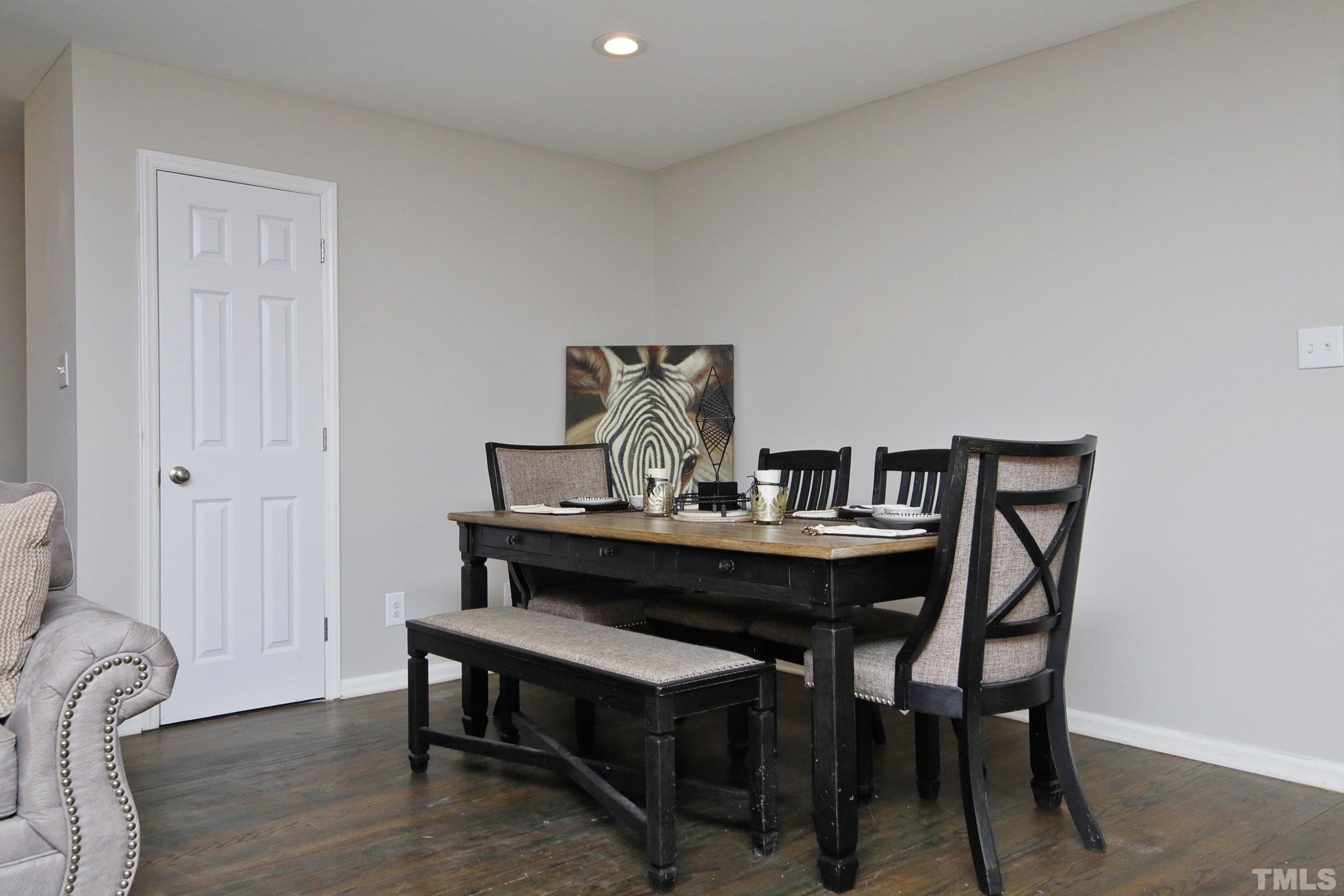 6120 Guess Road Durham, NC 27712 - Photo 5 of 22 a view of a dining room with furniture and wooden floor