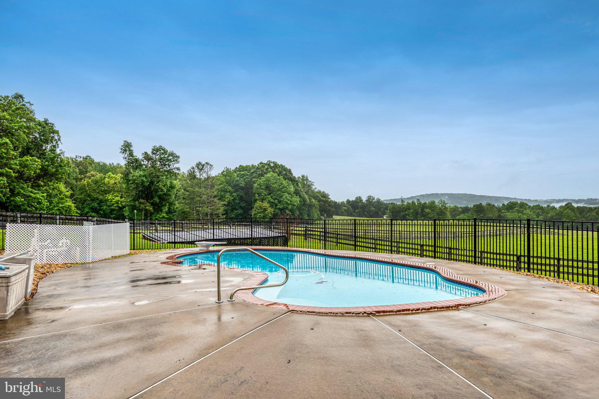 7961 Leeds Manor Road Marshall, VA 20115 - Photo 32 of 40 a view of a swimming pool with a patio