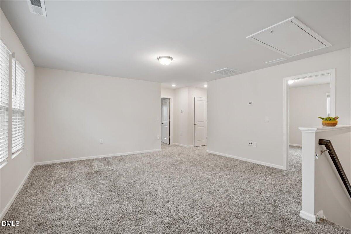 46 Coffee Tree Circle Clayton, NC 27527 - Photo 18 of 36 a view of an empty room with a window